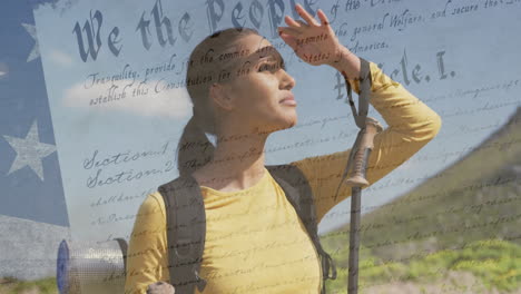 animation of american flag over biracial woman looking away in mountains