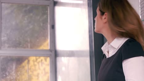 businesswoman waiting for a train using tablet