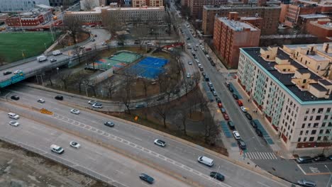 4K-drone-over-highway-and-cars,-buildings,-day,-New-York-City