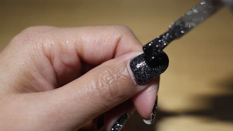 sequential application of glitter nail polish