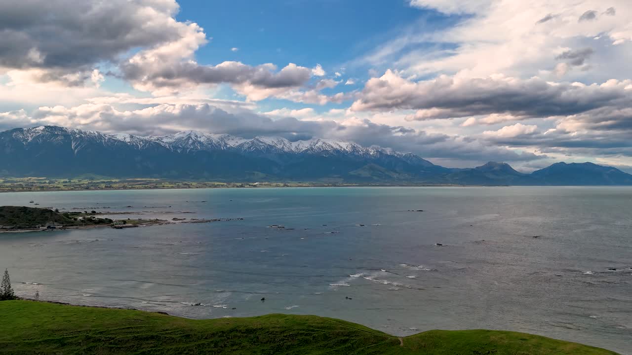 Drone hyperlapse over the Kaikoura coast, heading towards New Zealand's Southern Alps