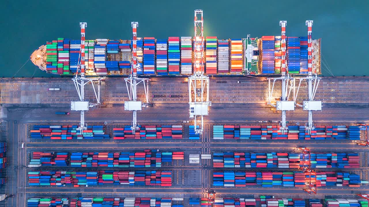 Aerial view, 4K.Time lapse Industrial port with Container port where is a part of shipping