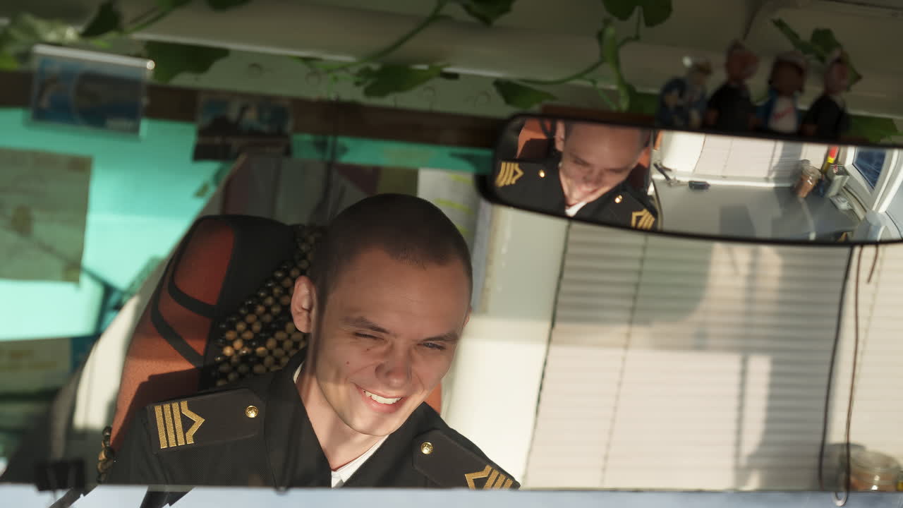 Man in military uniform inside a vehicle