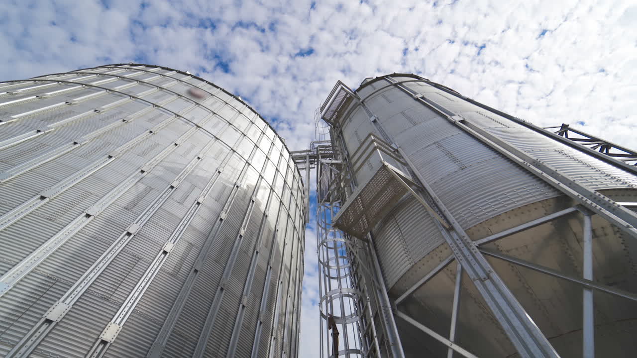 Grain elevator for storage of agricultural crops. Modern silos. Close-up.