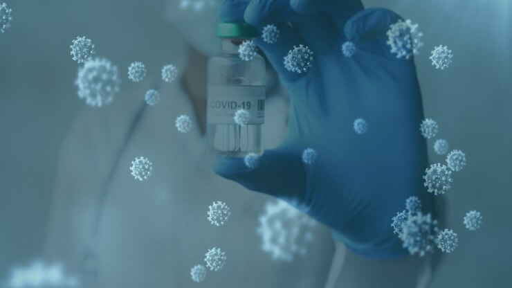 Animation of covid 19 cells and masked gloved doctor holding vaccine