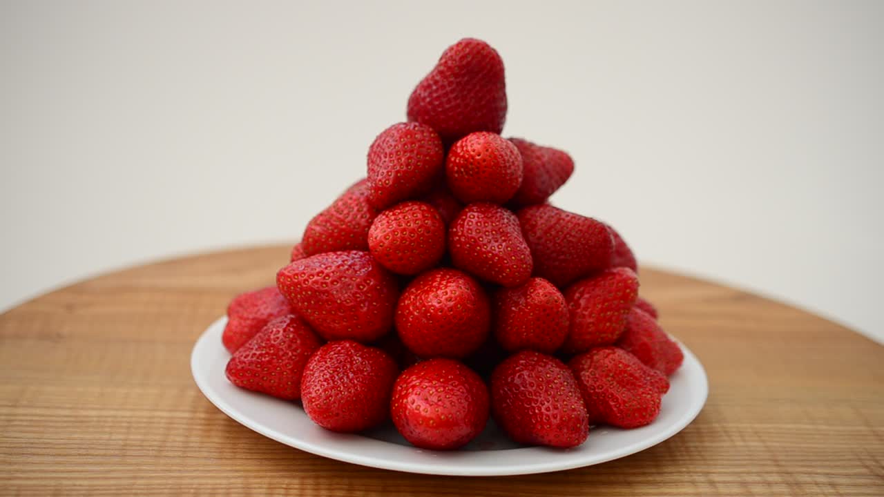 Strawberry on a white background. Shooting in the movement