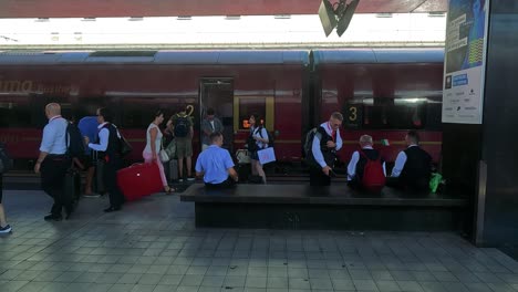 passengers boarding train at turin station