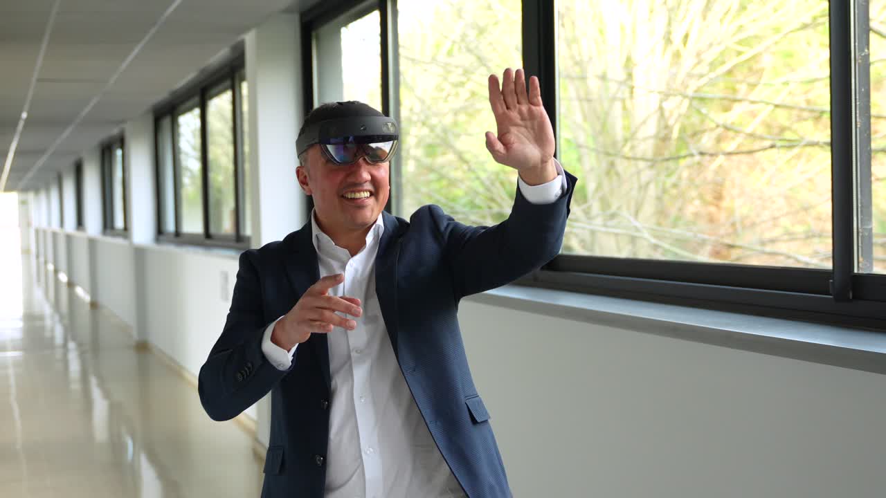 Man wearing virtual reality glasses in a hallway