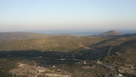 Aerial-rises-over-sparce-arid-hill-landscape-on-Greek-island-of-Chios