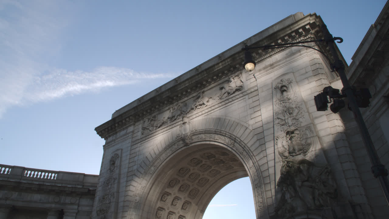 Traffic passing the Manhattan Bridge Arch and Colonnade. Shot on an autumn morning in New York City