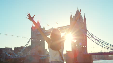 a carefree woman waving her arms in the air