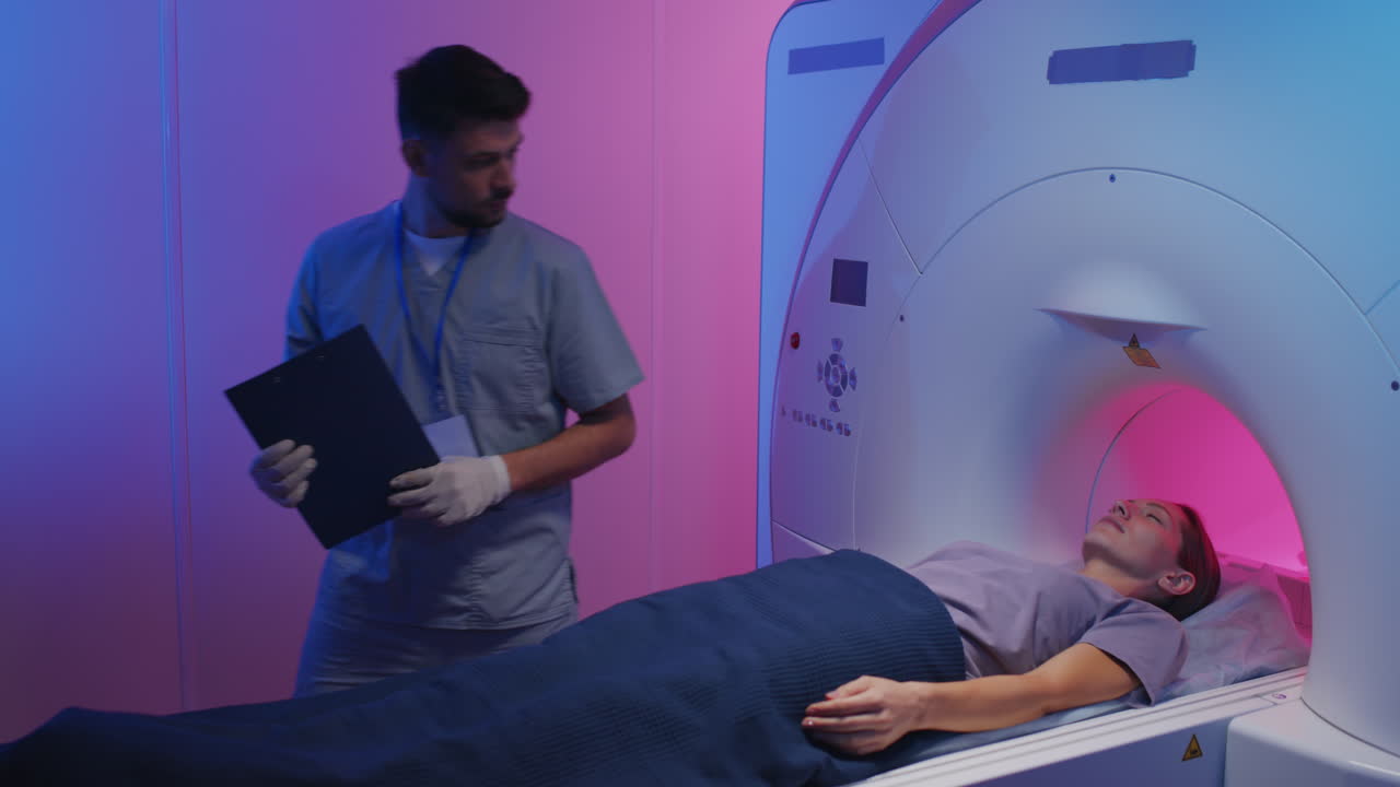 Woman Getting into Tube for MRI