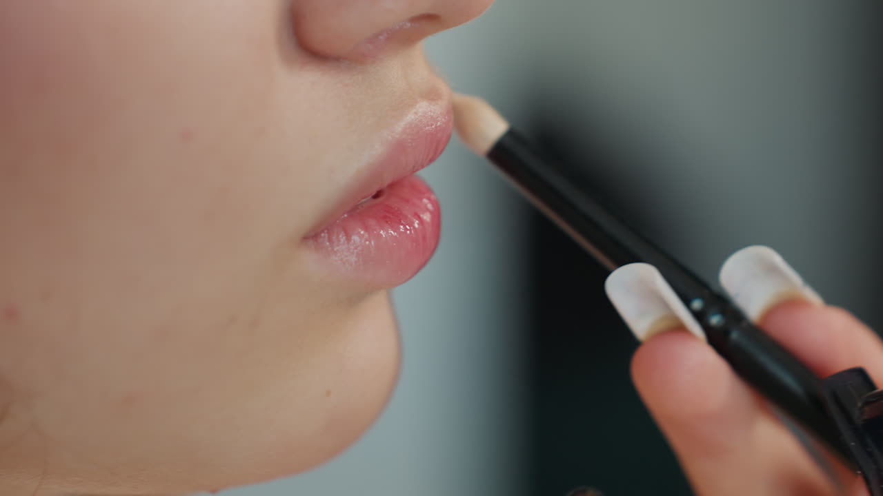 Elegant Lips With Precise Application, Caucasian Lips Highlighted By Expert Makeup Skills, Detailed Image Of Lips Receiving Meticulous Cosmetic Lining In Calm Professional Environment