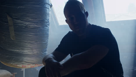man sitting in attic room