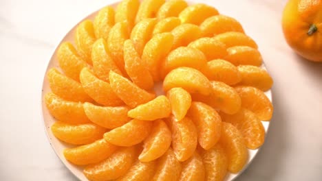 fresh oranges on plate - healthy concept