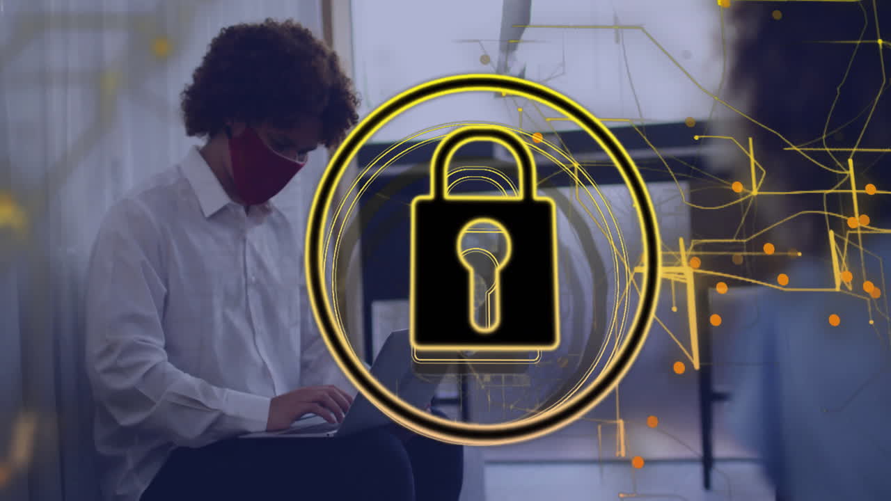 Man typing on laptop in lobby, featuring cybersecurity padlock overlay with yellow circuit graphics
