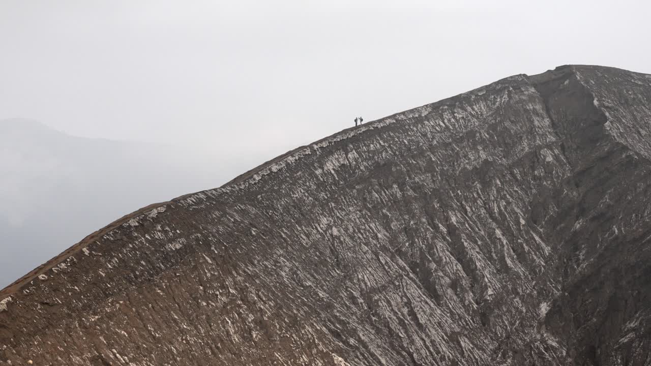 Mount Bromo active volcano crater climbing mountainside Java island Indonesia