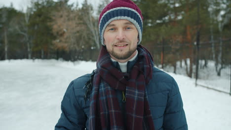 man smiling in winter park