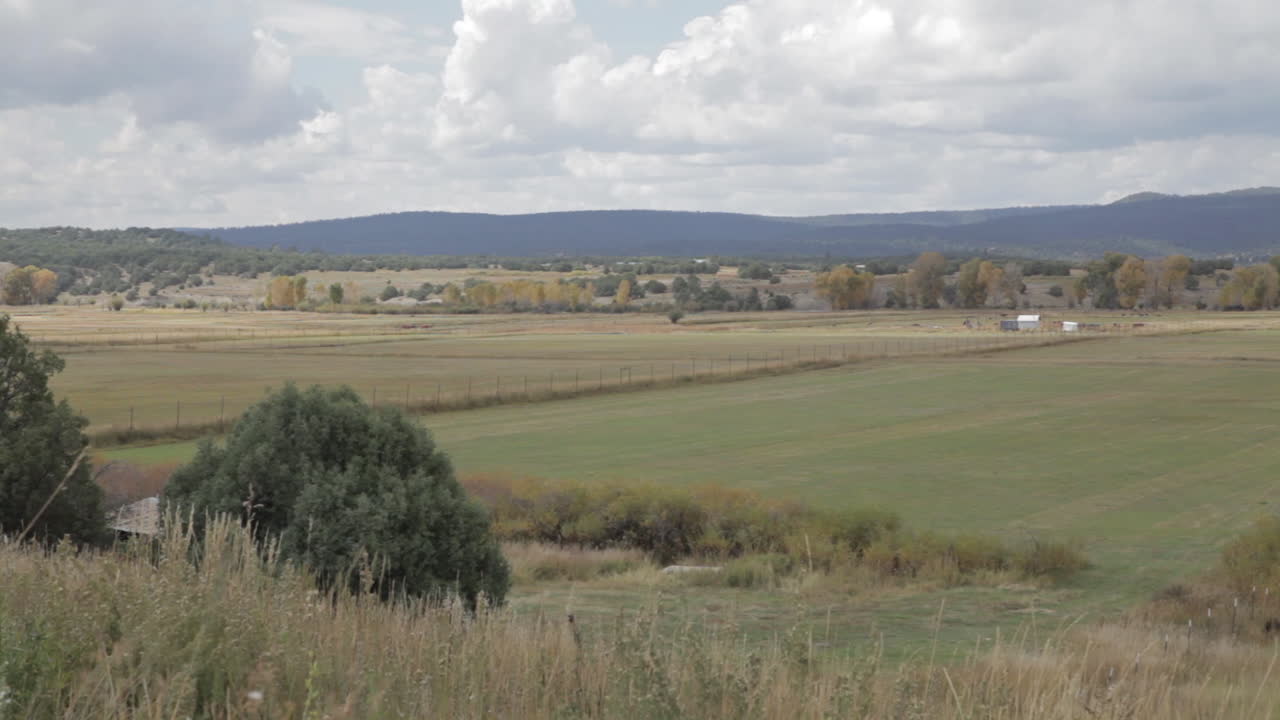 Picturesque Landscape with Fields and Mountains
