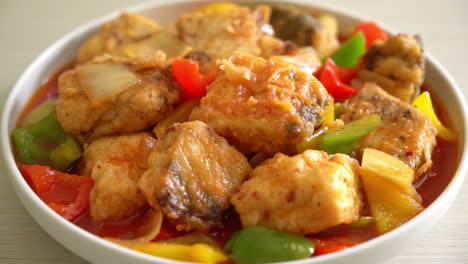 fish stew with tomato and pepper on plate