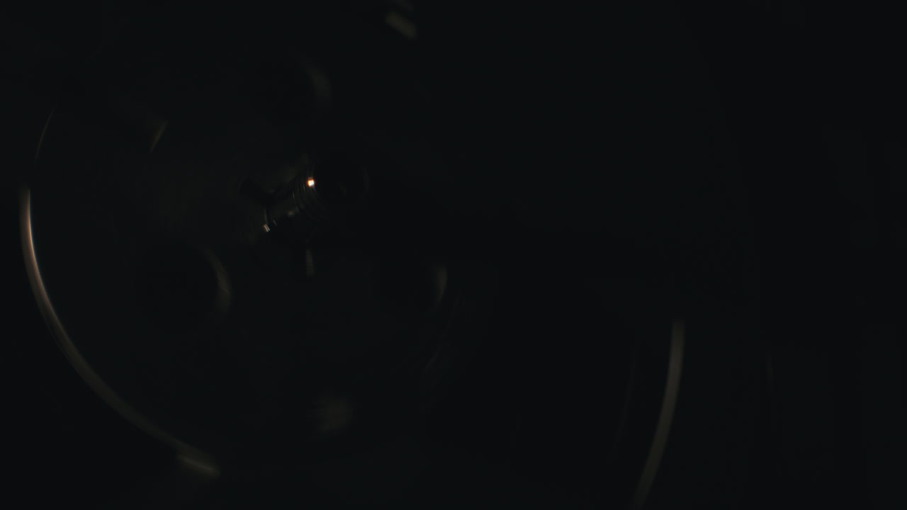 A vintage tape recorder in a blinking light