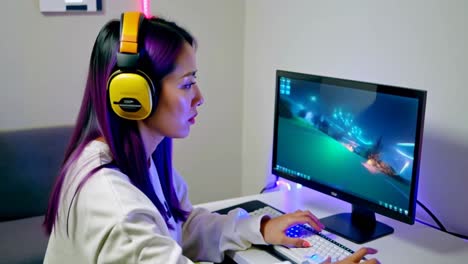 a woman is playing a video game on a computer