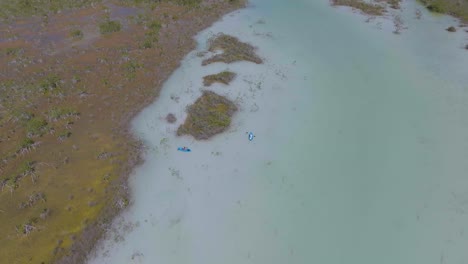 Kayakers-in-Breathtaking-Bacalar,-Mexico-Landscape---Aerial-Establishing-View