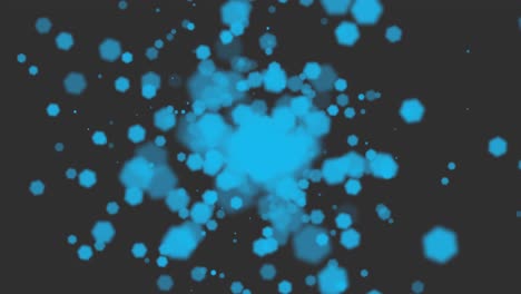 pequeñas partículas azules y bokeh redondo en un fondo brillante
