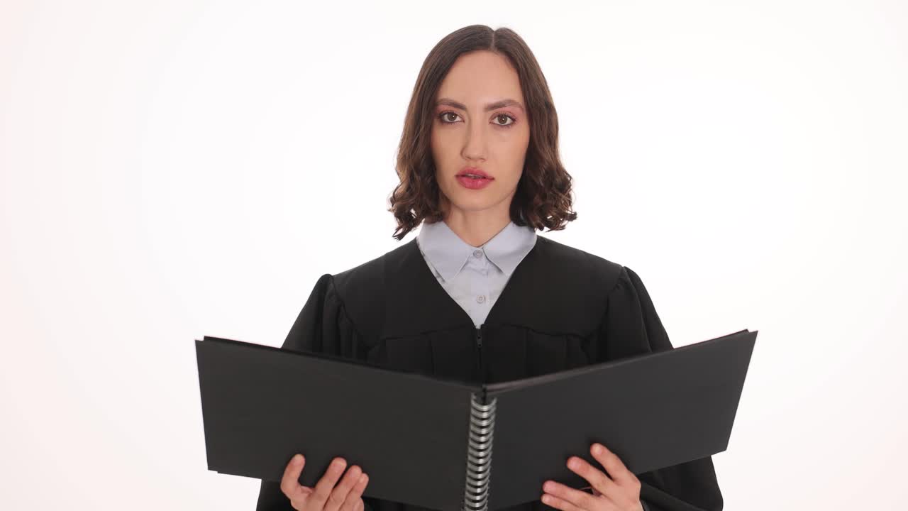 Woman in judicial robe with book