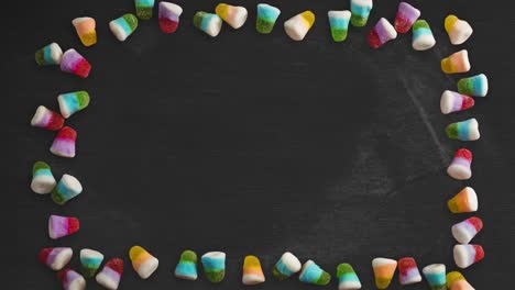 Animation-of-halloween-jelly-candy-over-black-background