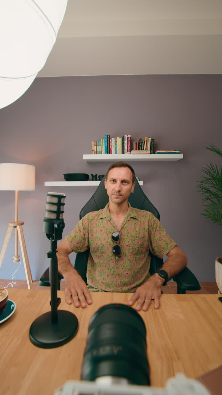 Man vlogging in home studio setup