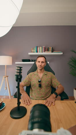 man vlogging in home studio setup