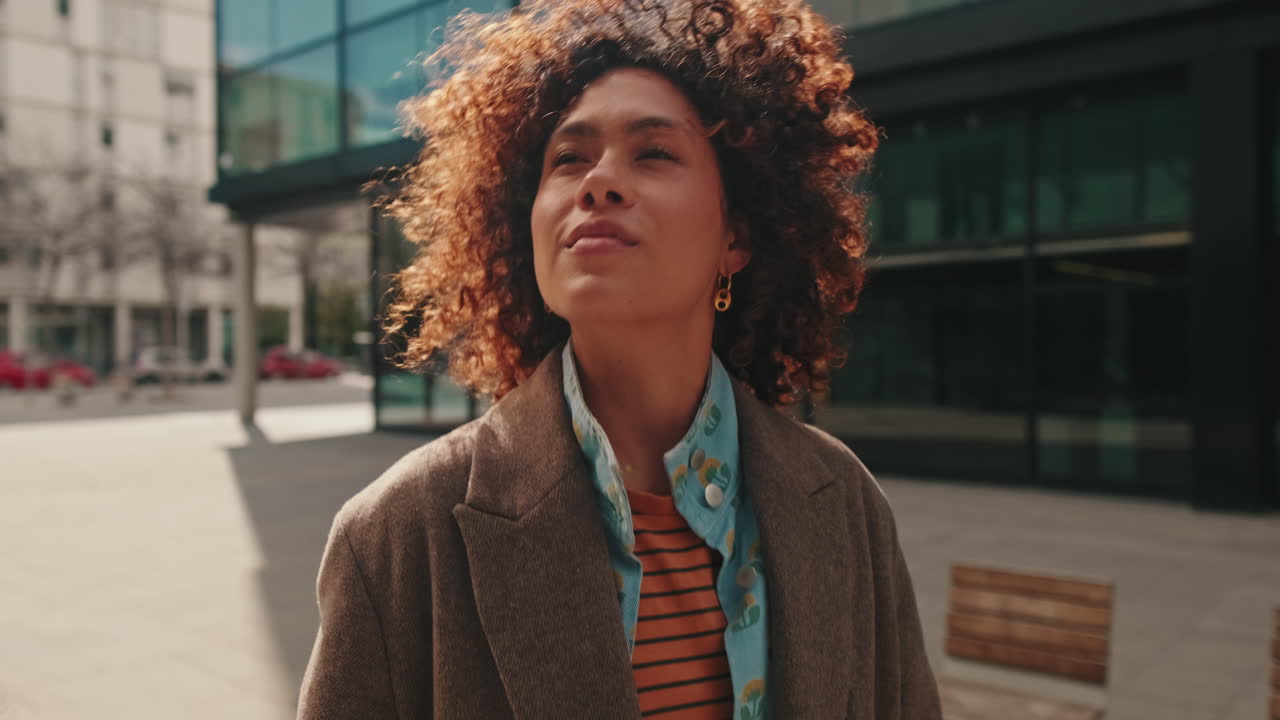 Young Woman Walking Confidently in the City