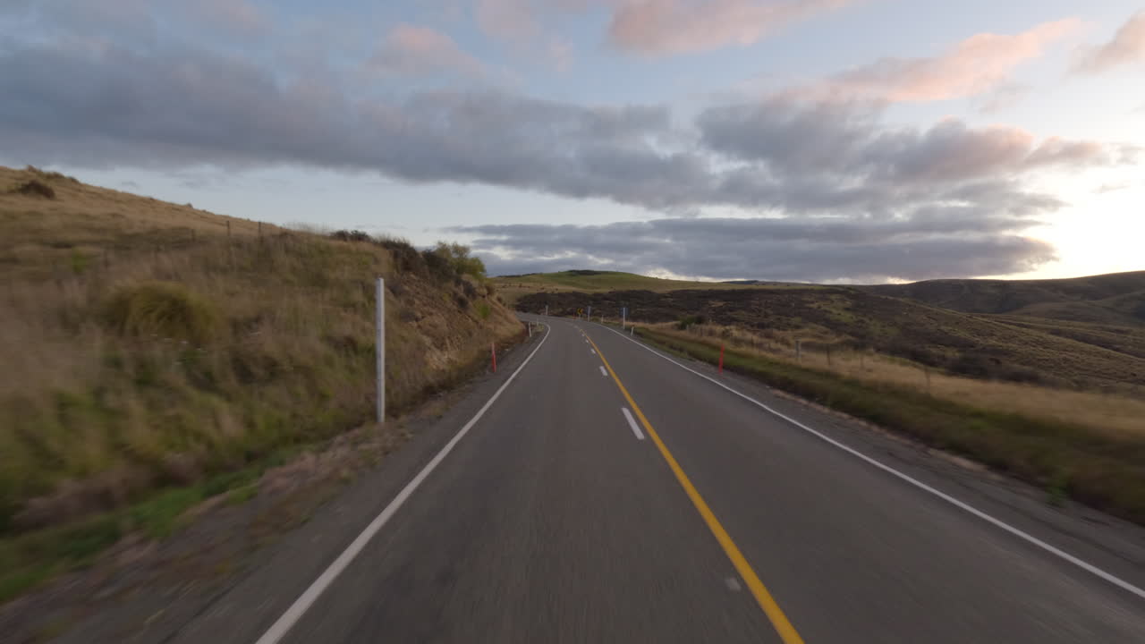 Driver's POV Driving Through The Countryside Highway In South Otago, New Zealand