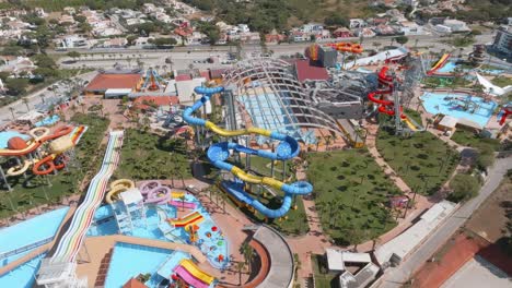 aerial orbit above empty water park slides and pools in algarve portugal