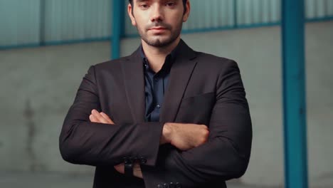 portrait confident factory manager wearing suit and safety helmet