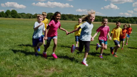 happy children running and playing in a sunny grassy field