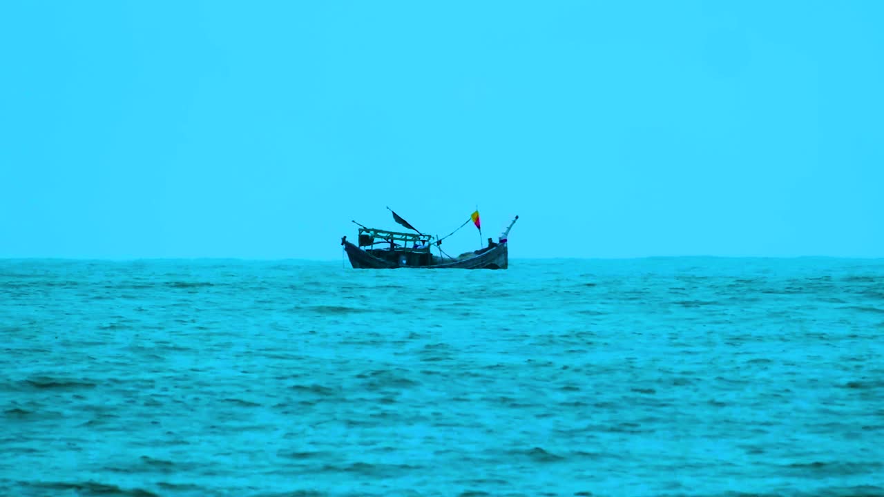 A fishing trawler peacefully drifting in the Bay of Bengal on a windy day