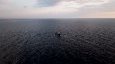 isolated carrier cargo ship navigating in open sea