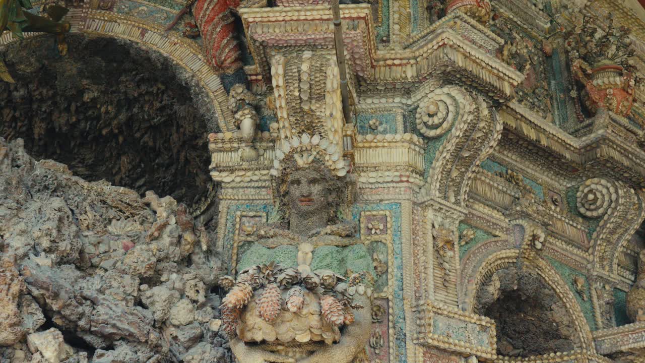 Intricate stone arch with rough texture dominates the scene in Munich Residenz royal palace, Germany