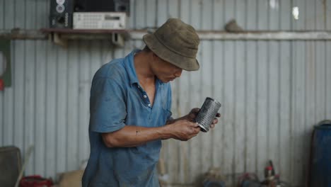 mechanic inspecting an oil filter