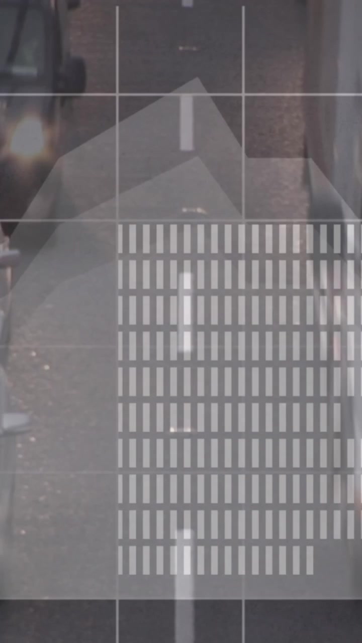 Animation of statistical data processing against aerial view of city traffic