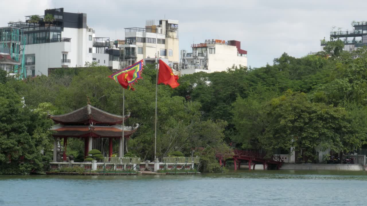National flags fly, Ngọc Sơn Temple, Ho&agrave;n Kiếm Lake, central Hanoi, Vietnam