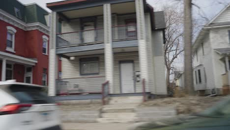 residential homes in minneapolis minnesota seen from a driving car - pov