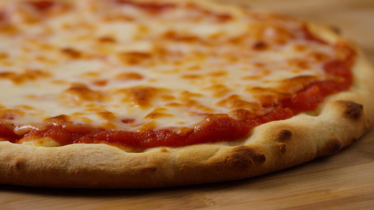 Closeup Cheese Pizza Crust Edge, Bubbling Mozzarella With Even Browning, Thin Handstretched Crust On Wooden