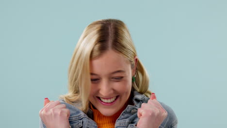 excited, celebration and face of woman on blue