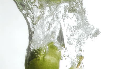 pears in super slow motion falling in the water