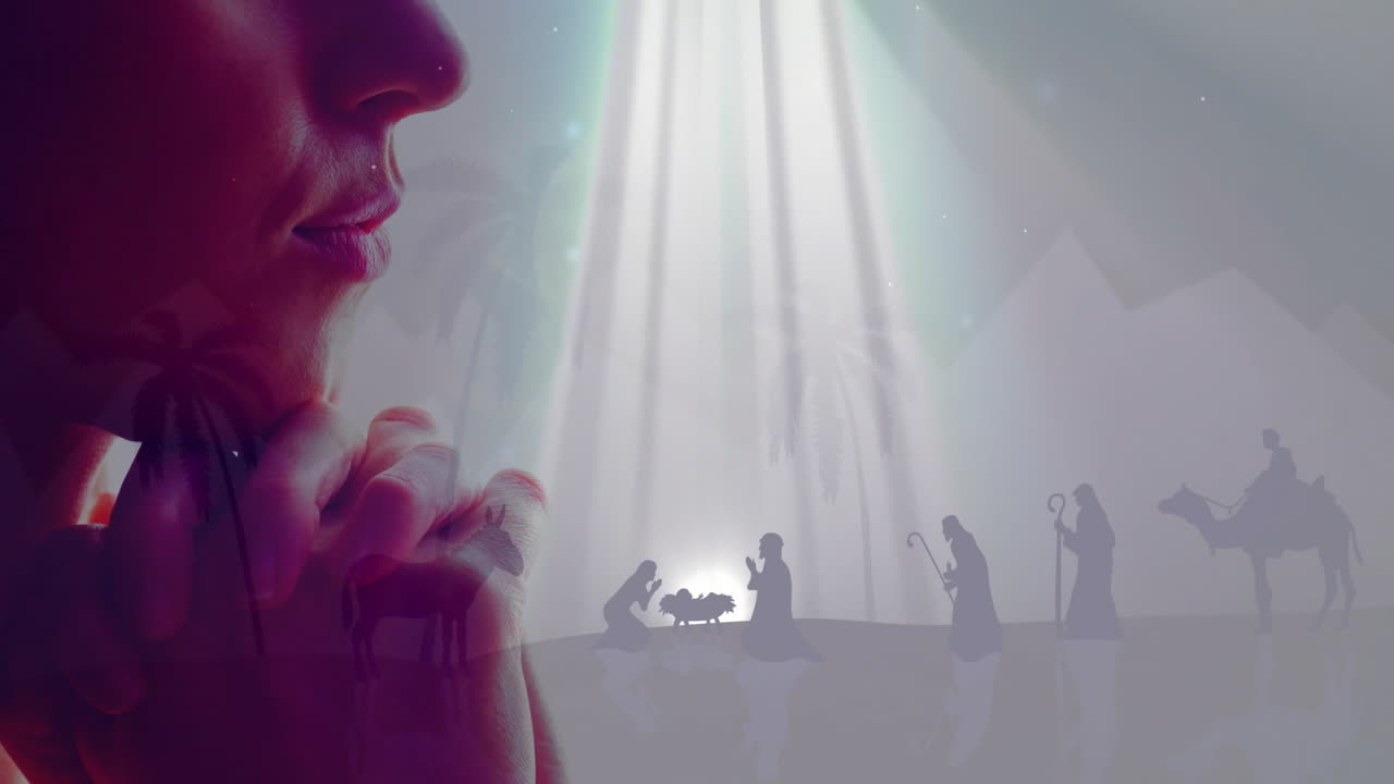 Praying person with nativity scene and light rays creating animation effect