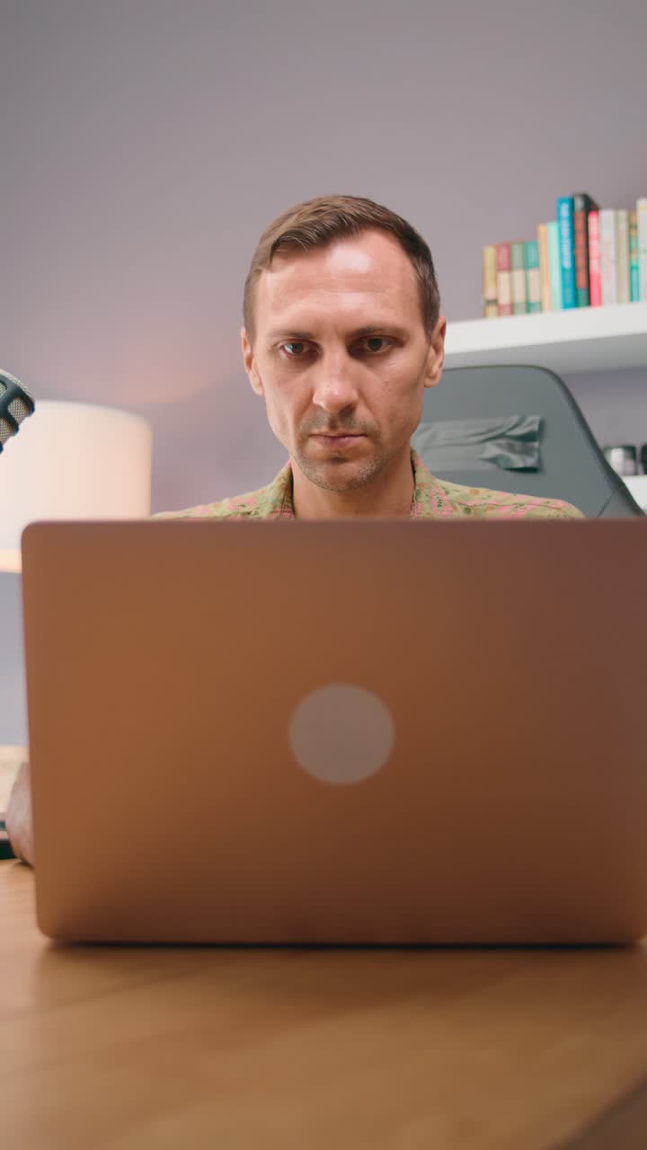 Man working on a laptop at home