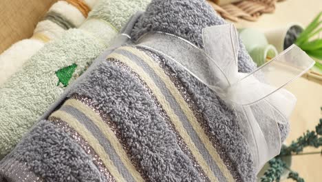 wrapped grey and green striped towels